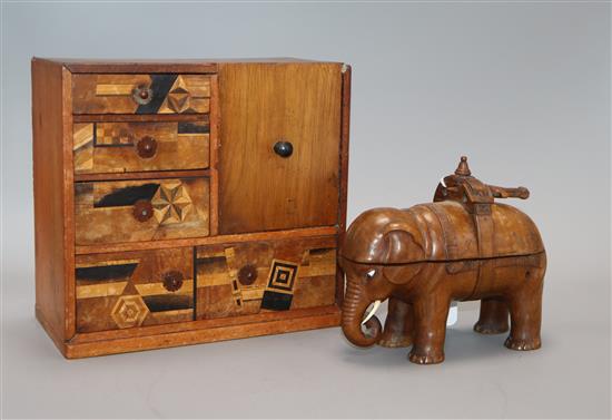 A Chinese carved elephant inkstand and a parquetry table cabinet tallest 19.5cm